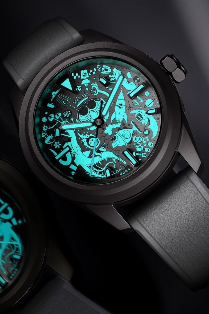 The fun details of artwork by Nicolas Barrome Forgues spring to life on the Awake Dare & Dream's luminescent dial.