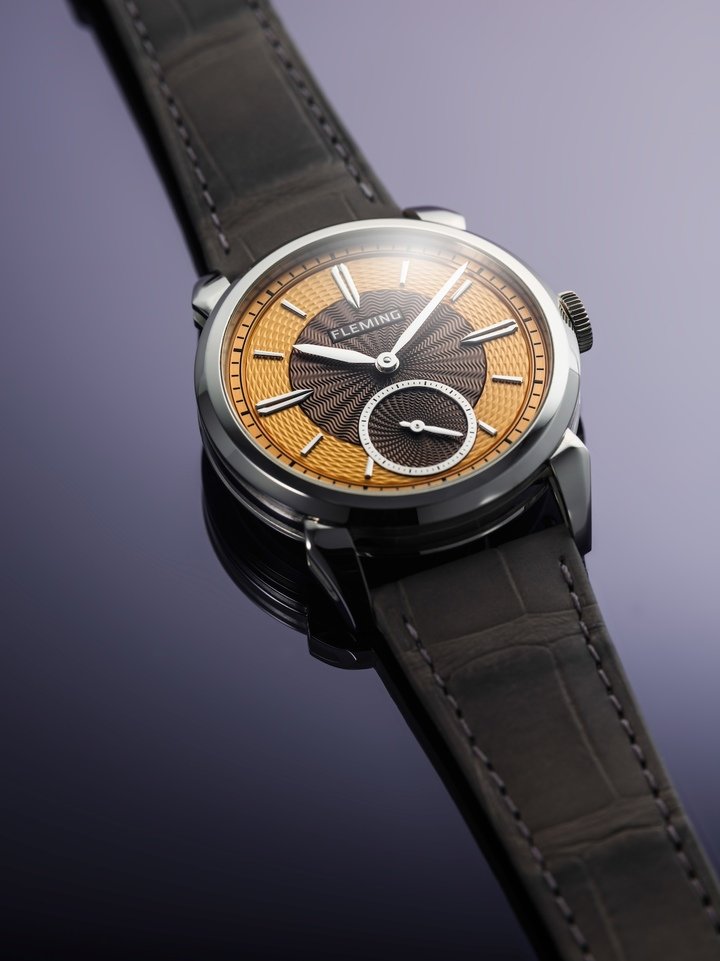 Platinum, available in 9 pieces, features a guilloché dial in golden amber and rich brown with wave and petal patterns.