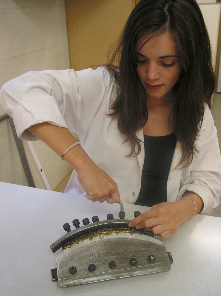 A student working on a component of the Clock from Jura