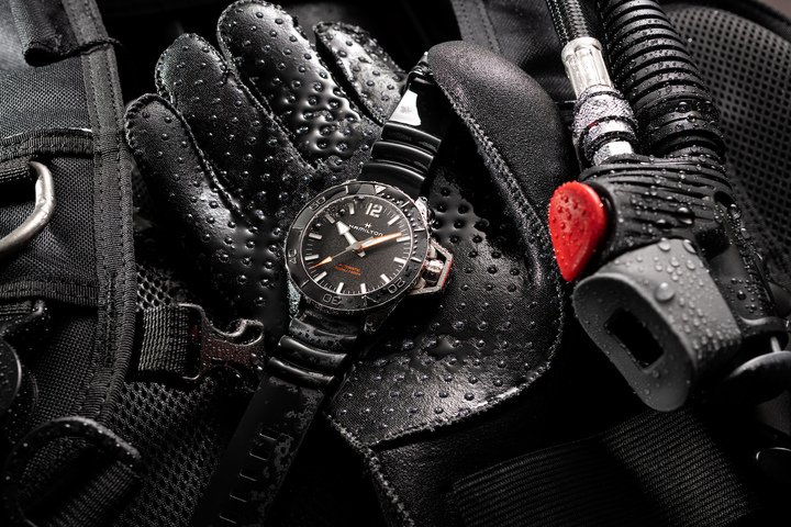 Cased in stainless steel and water resistant to 30 bar (300 m), the Frogman is available with the Hamilton's new wave-look tactical rubber strap in khaki or black, or on a traditional bracelet. In addition, a version with its case coated in black PVD, with grey bezel and dial markings, offers a stealthier, ultra-modern look.